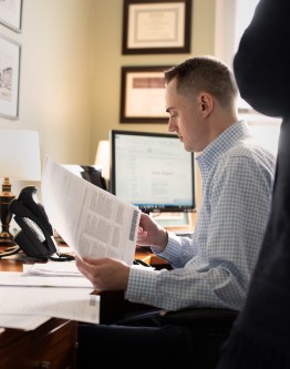 P. BENJAMIN FLOOD at desk